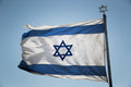 Blue & White Israeli Flag Photography — Jewish Jerusalem — Israeli Flag flapping in Wind With Iron David Star On The Top