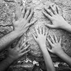 Black and White Jewish Kotel — Father & children hands praying at the Western Wall