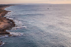 Seascape Sunset Photography print with a fisherman on rocks and boat at the sunset — Rosh Hanikra, Israel — Canvas