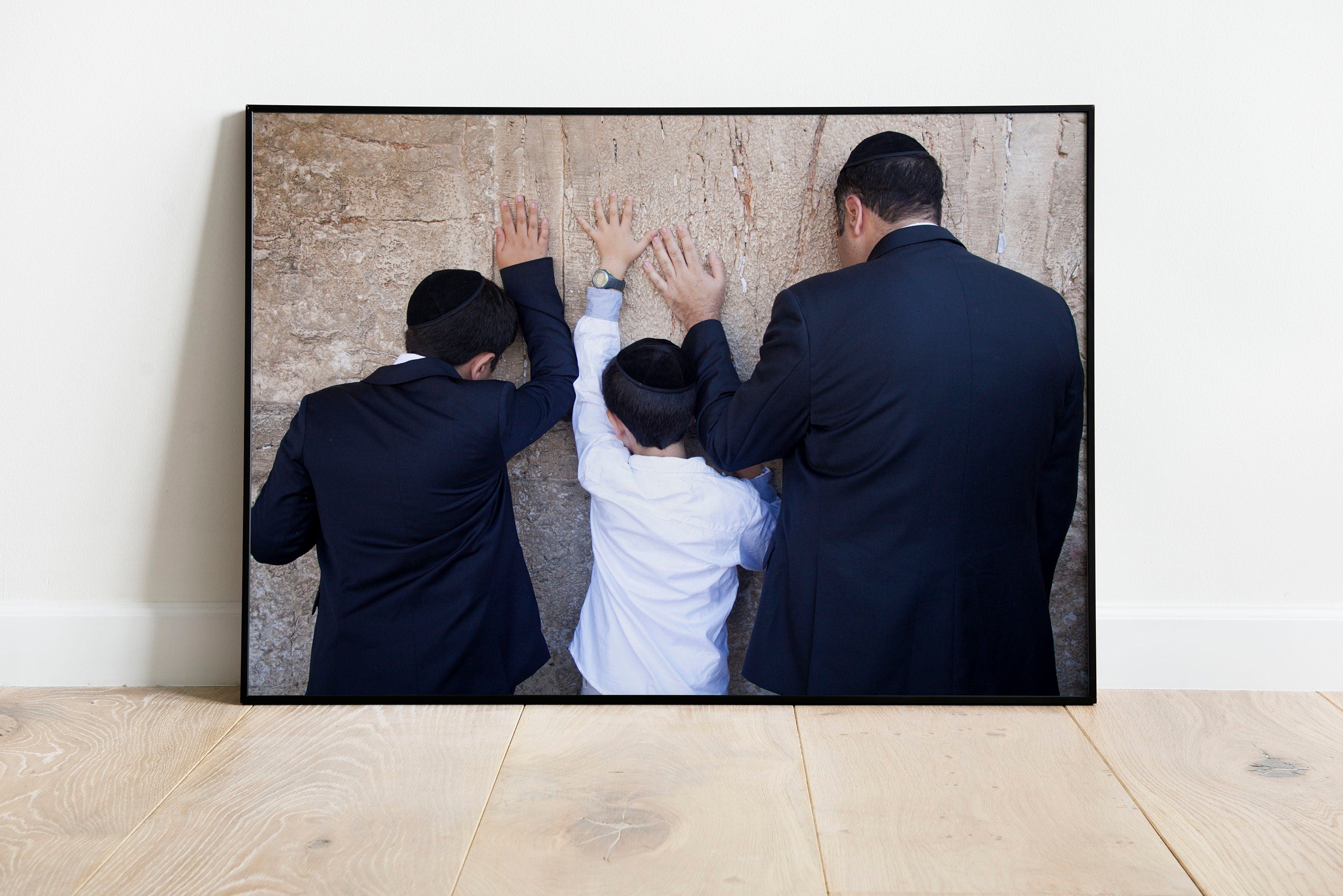 Jewish Wall Kotel — Father and sons praying on a stone of the wailing wall, the Kotel, Jerusalem
