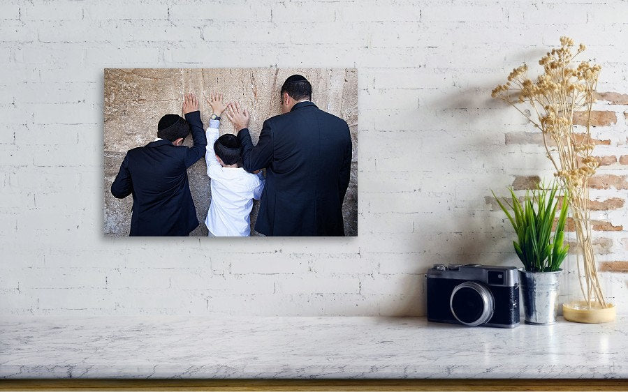 Jewish Wall Kotel — Father and sons praying on a stone of the wailing wall, the Kotel, Jerusalem
