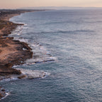 Seascape Sunset Photography print with a fisherman on rocks and boat at the sunset — Rosh Hanikra, Israel — Canvas