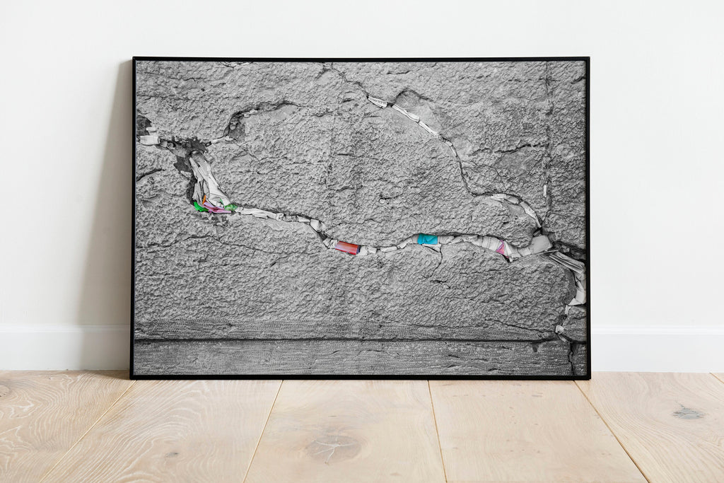 Black and White Jewish Kotel Stone with Colored Prayer Paper Notes between Stones