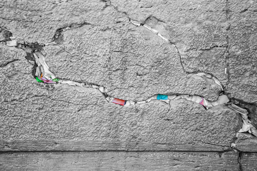 Black and White Jewish Kotel Stone with Colored Prayer Paper Notes between Stones