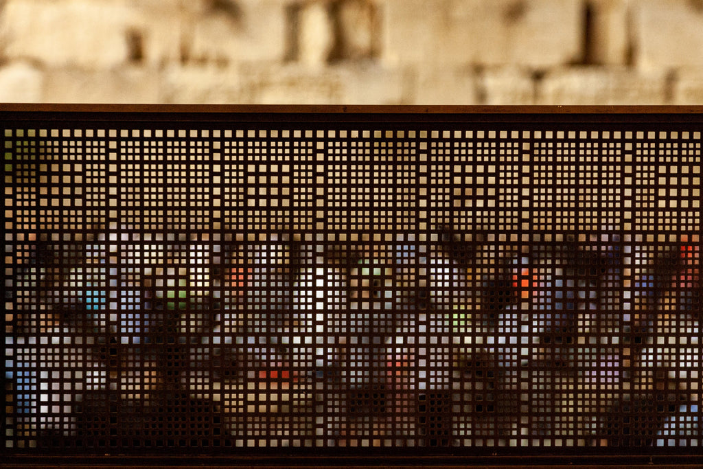 Jewish Israeli Kotel Western — Fence with Prayers by night at the Kosel Praying Selichot — Abstract Jerusalem Wailing Wall Stones