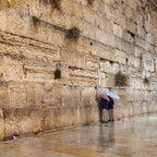 Two Prayers Alone with Umbrella at the Gold Kotel Wall Art by Night and during the Rain — Jerusalem Western Wall