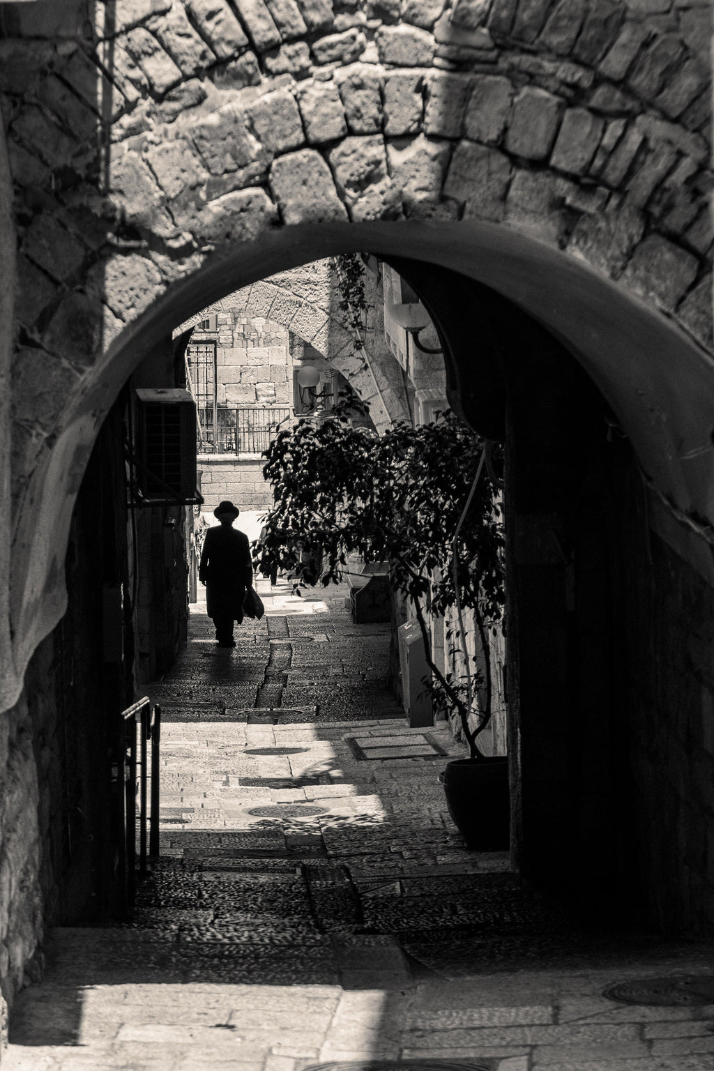 Black and White Jerusalem Old City Pedestrian Street with Jewish Orthodox walking to the Kotel