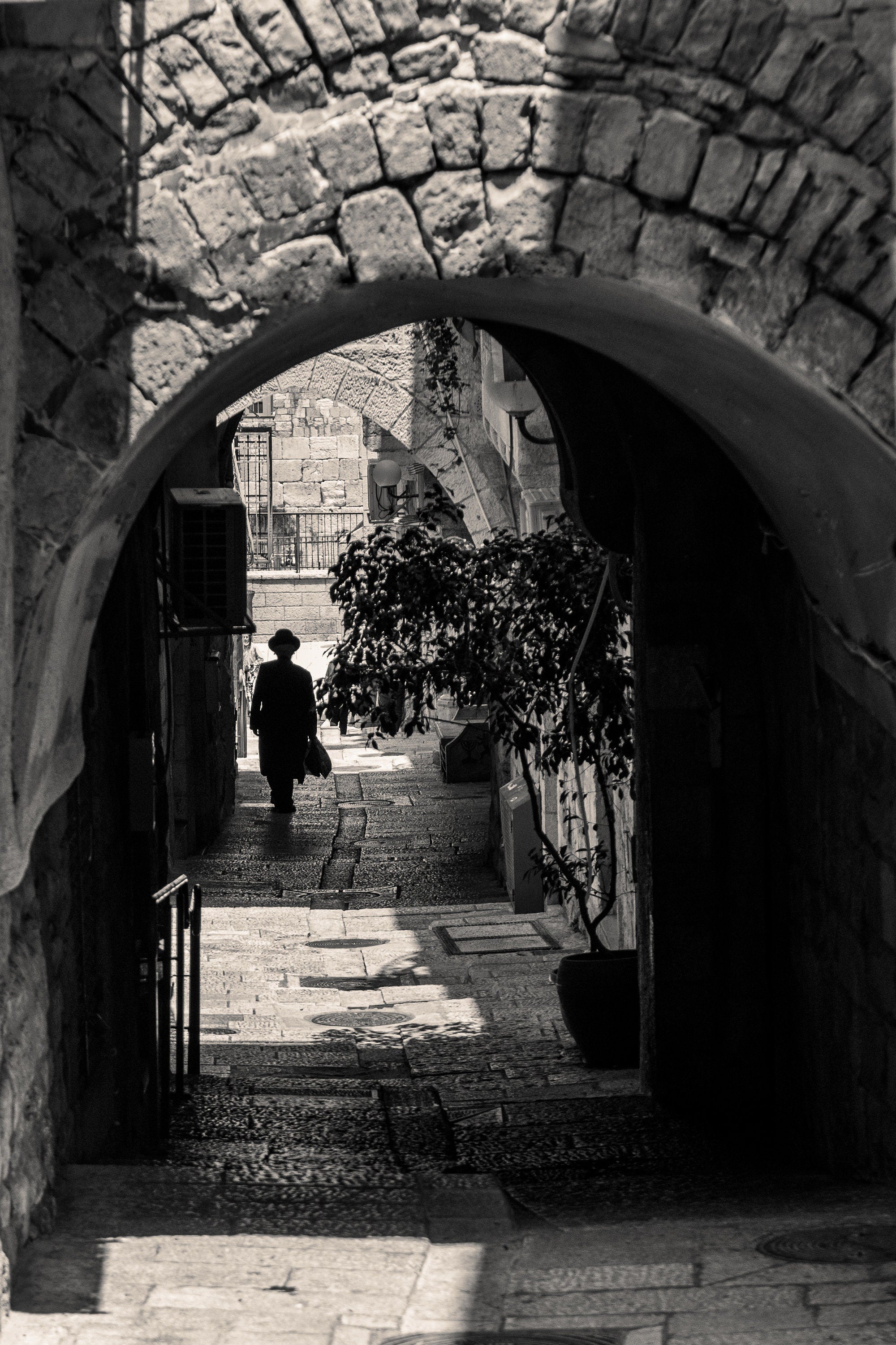 Black and White Jerusalem Old City Pedestrian Street with Jewish Orthodox walking to the Kotel