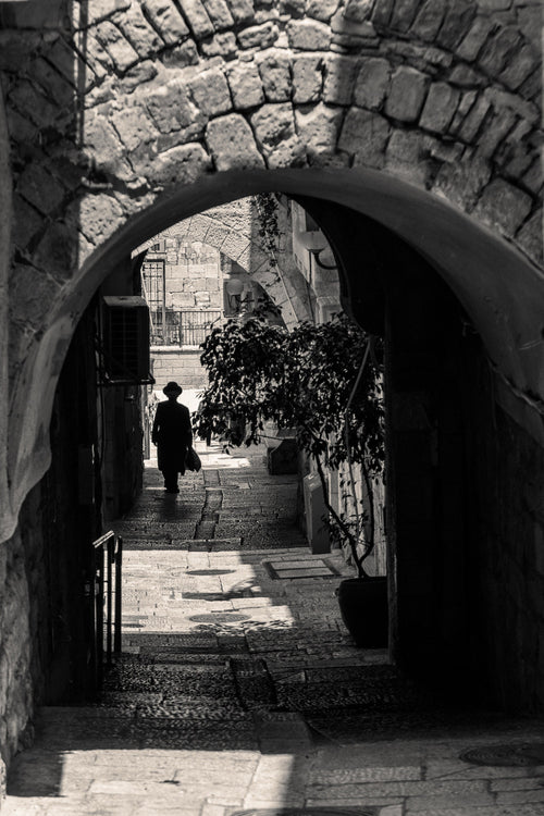 Black and White Jerusalem Old City Pedestrian Street with Jewish Orthodox walking to the Kotel