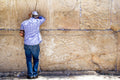 Jewish Man Praying with Tefillin at the Jerusalem Old City Kotel Western Wall