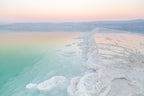 Turquoise Dead Sea Israeli Holy Land Sunset with White Salt Sea Minerals