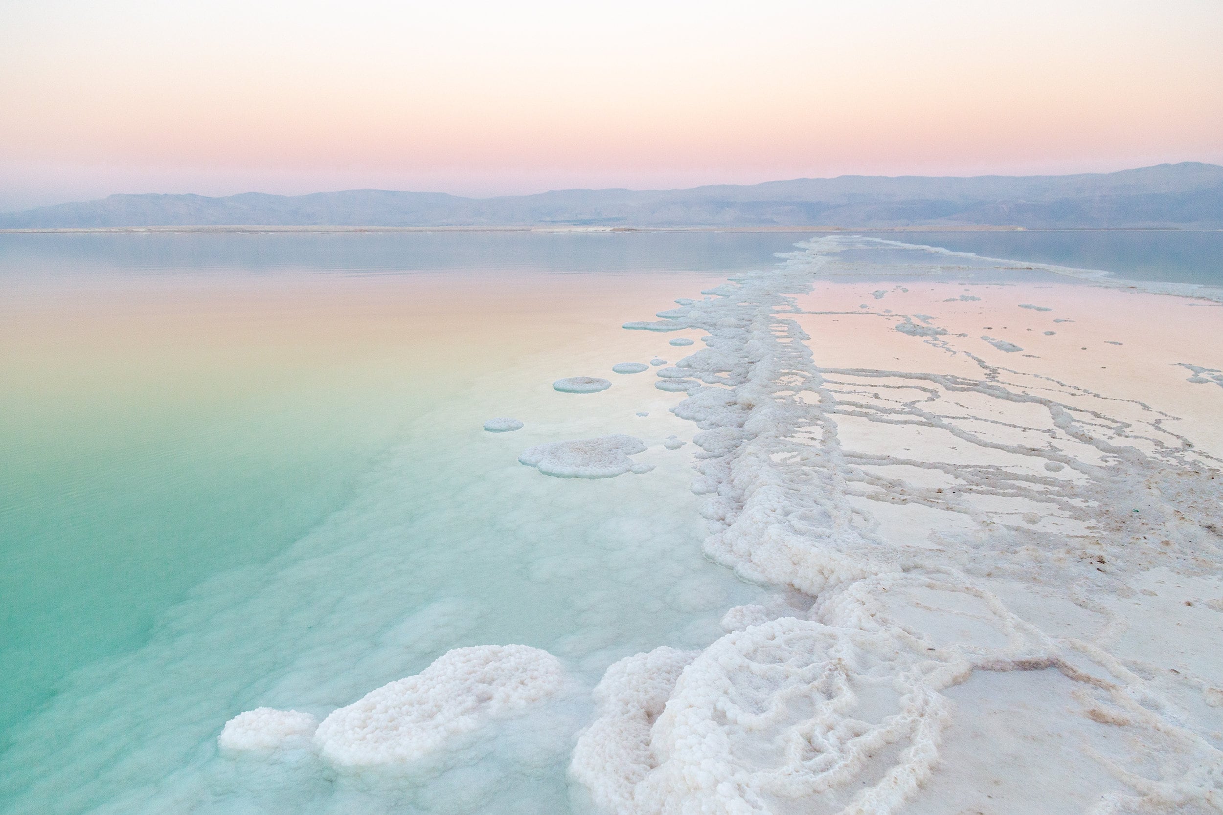 Turquoise Dead Sea Israeli Holy Land Sunset with White Salt Sea Minerals