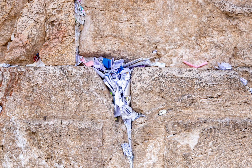 Stone of the Kotel Western Wall with Colorful Prayer Paper Notes
