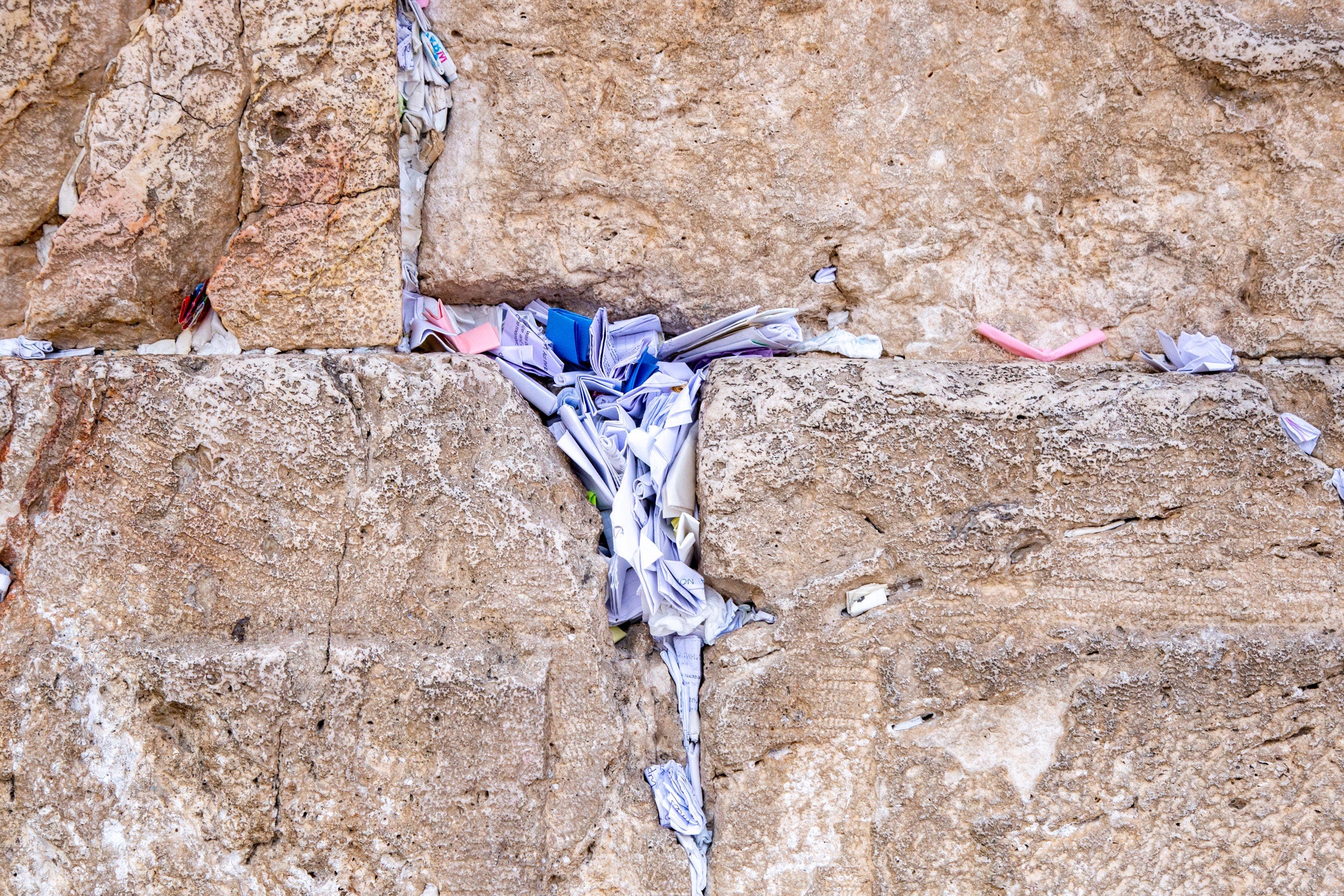 Stone of the Kotel Western Wall with Colorful Prayer Paper Notes