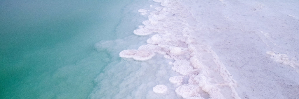 Panoramic Turquoise Dead Sea Israeli Sunset with White Salt Sea Minerals