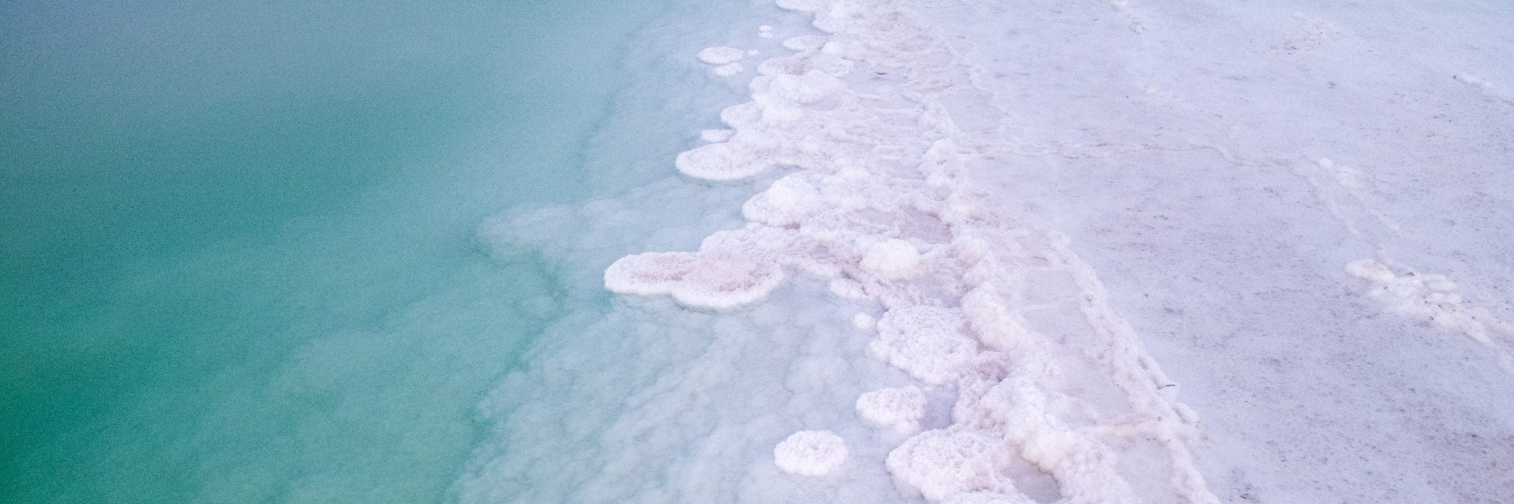 Panoramic Turquoise Dead Sea Israeli Sunset with White Salt Sea Minerals