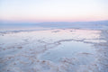 Colorful Dead Sea Israeli Holy Land Sunset with White Salt Sea Minerals and Silhouette