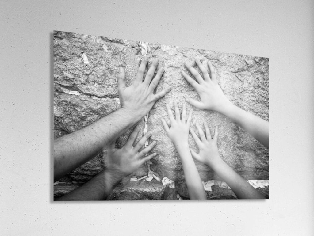 Black and White Jewish Kotel — Father & children hands praying at the Western Wall