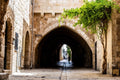 Jerusalem Old City Pedestrian Street with Tunnel Arch and a Girl in the Shadow