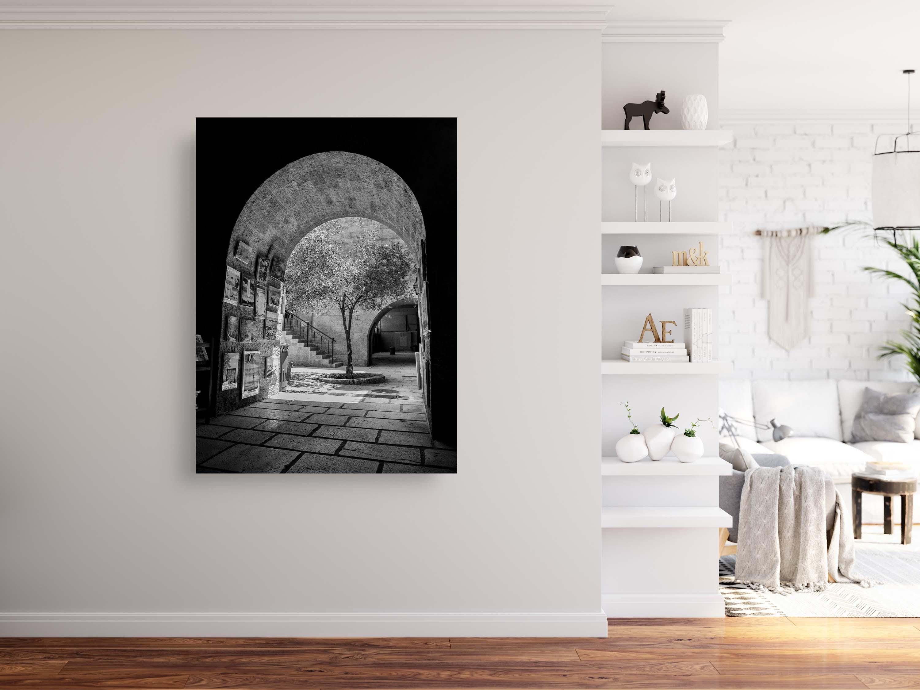 Black and White Jerusalem Old City Pedestrian Street with Olive Tree, Arch and Paintings on wall