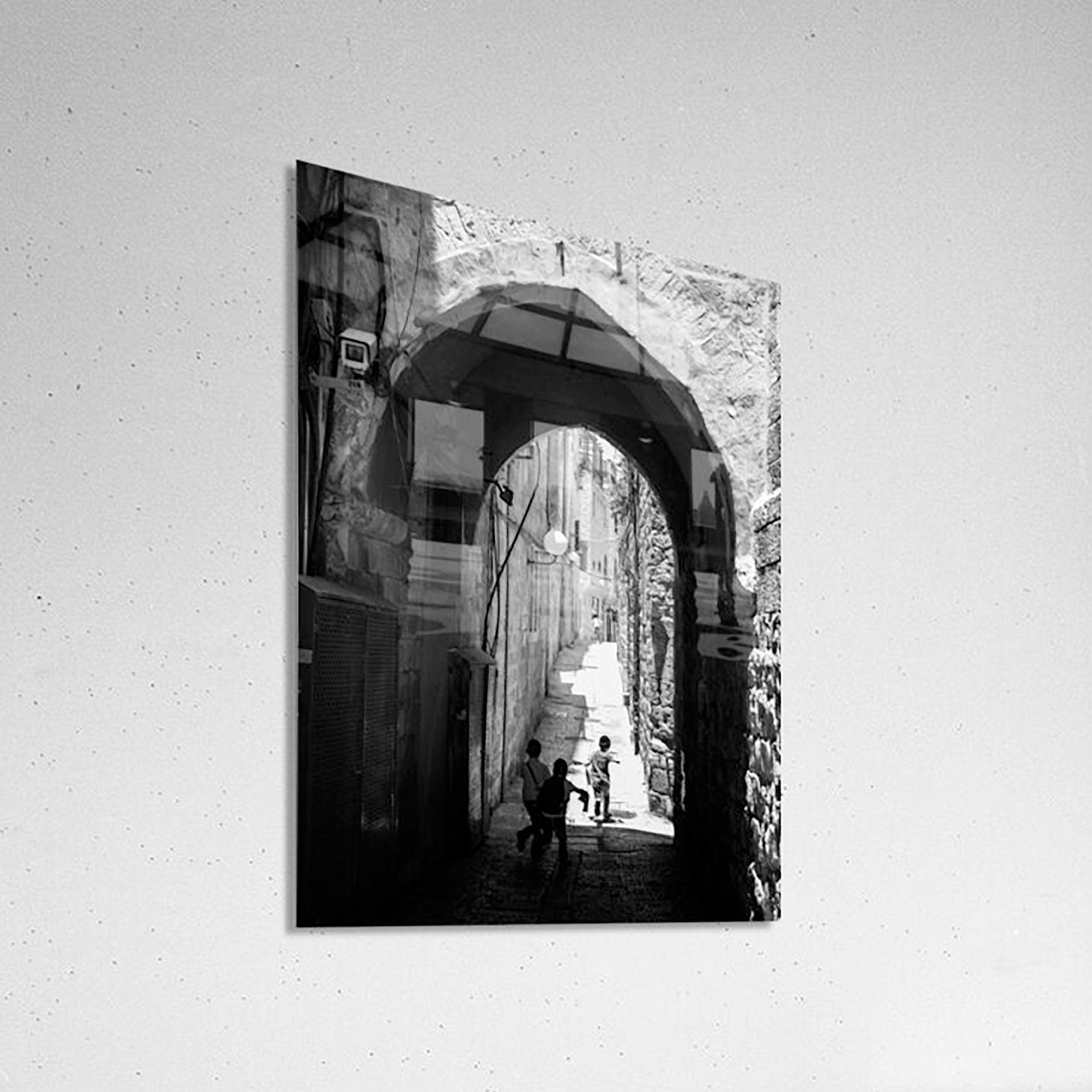 Black and White Jerusalem Old City Pedestrian Street with Jewish Children running from school and Stone Arche