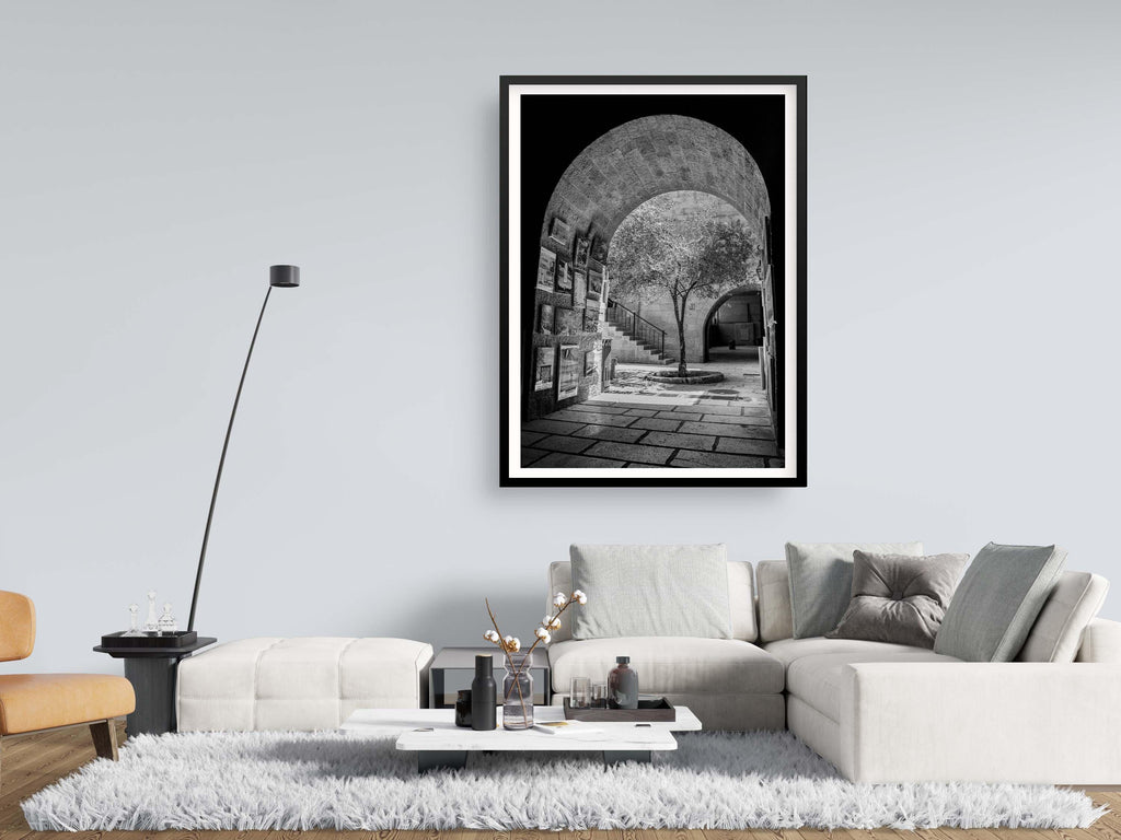 Black and White Jerusalem Old City Pedestrian Street with Olive Tree, Arch and Paintings on wall