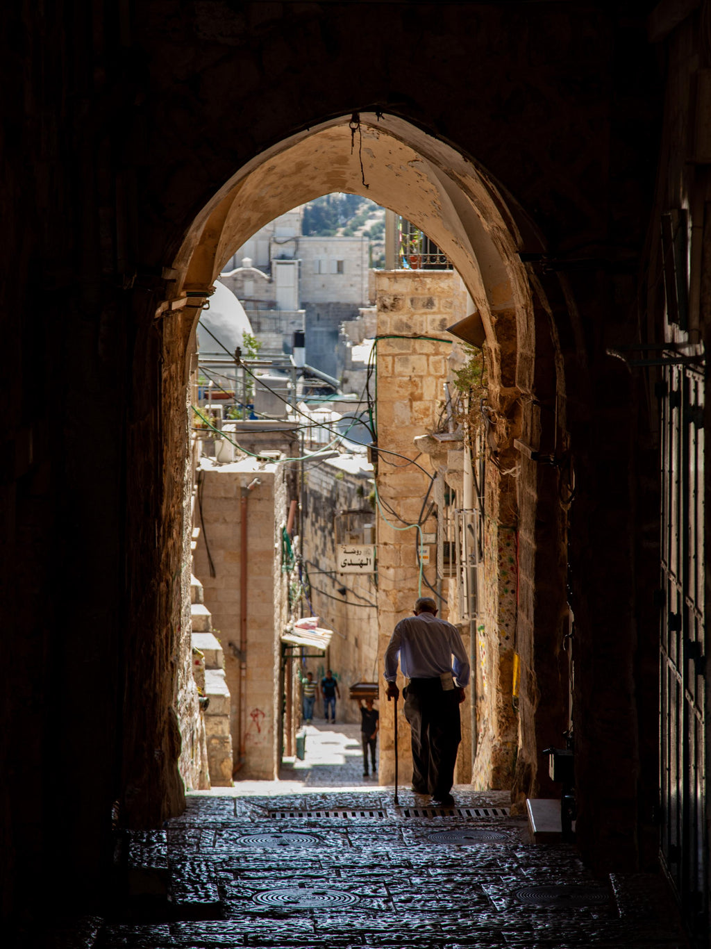 Jerusalem Old City Pedestrian Street with Old Man, Cane and Arch